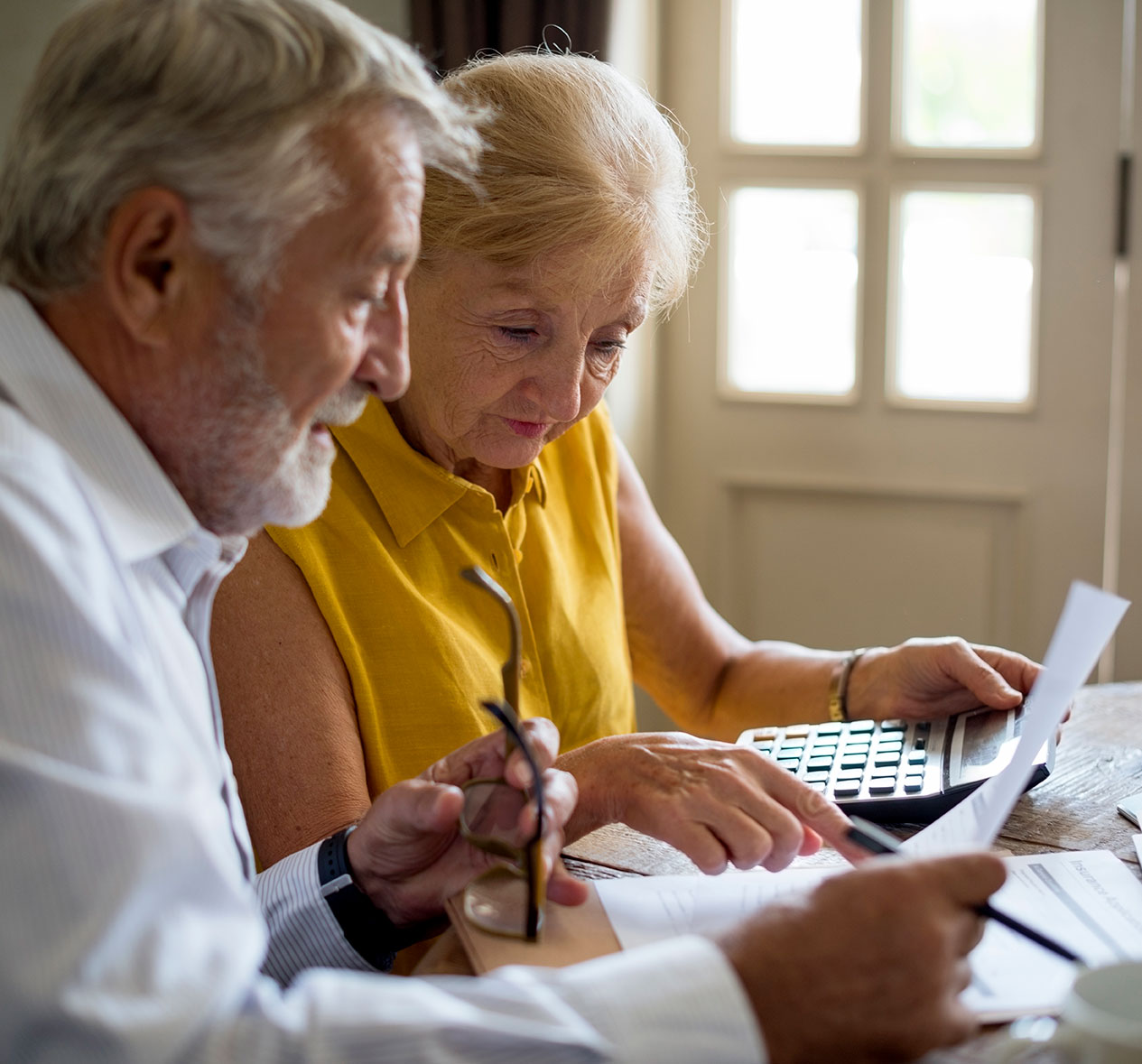 Senior couple looking at insurance application form